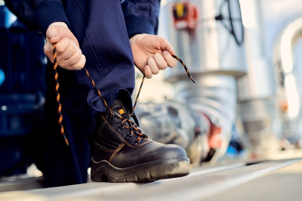 man tying his safety work boots